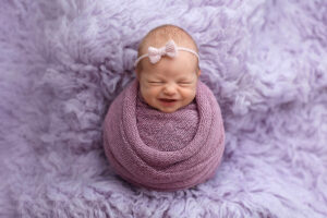 Kansas City Newborn Photographer Susy Photo Baby Purple Inspiration little smiles