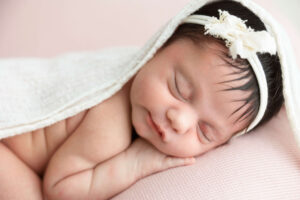 sleeping baby Kansas City newborn photographer when to book your newborn session