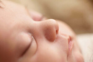 sleeping baby Kansas City newborn photographer when to book your newborn session